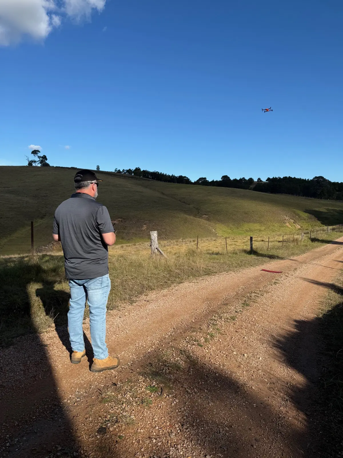 Mark Giddens flying a drone over a rural property in Gippsland