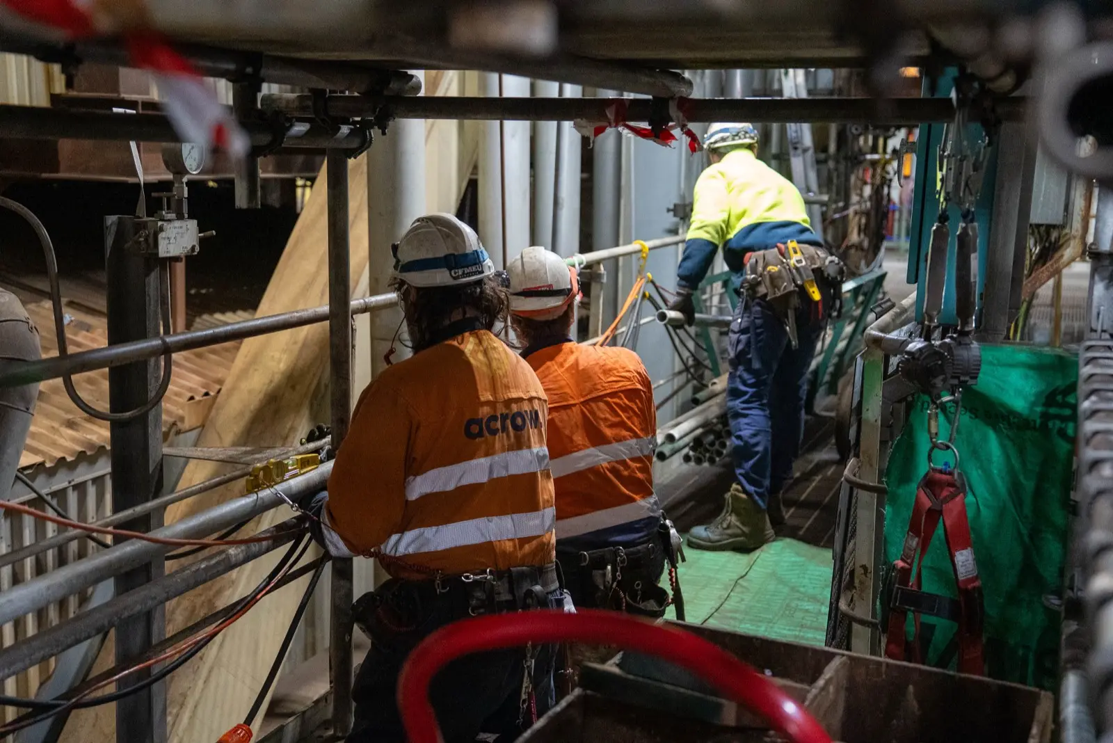 Filming maintenance crew in hi-vis inside a power station