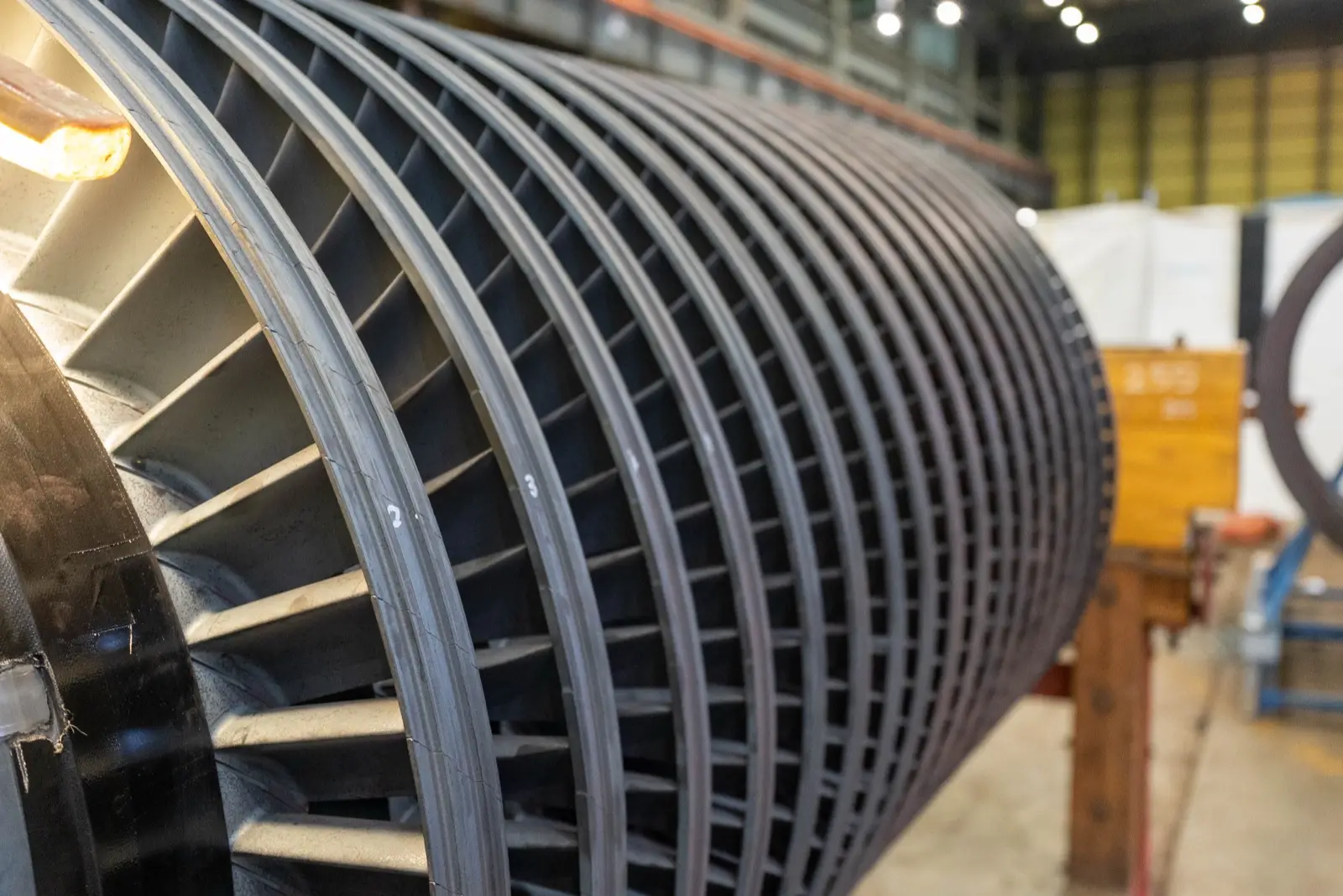 Close-up of a steam turbine rotor in a workshop